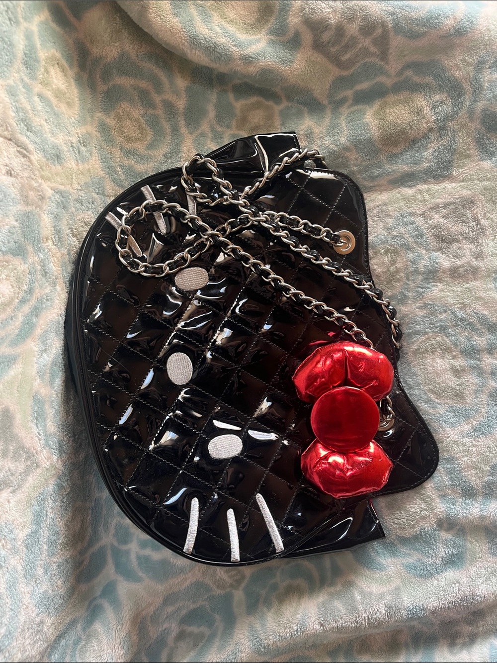 Sanrio Black Quilted Hello Kitty Crossbody Bag with Red Bow Accent